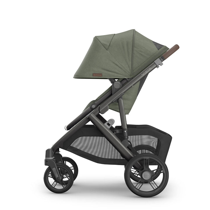 Side view of the UPPAbaby Vista V3 stroller in the Evelyn colourway, shown with the toddler seat upright and extended UPF sun canopy. Features premium leather handlebar, durable all-terrain wheels, breathable seat fabrics and an oversized under-seat storage basket, displayed on a clean white background.