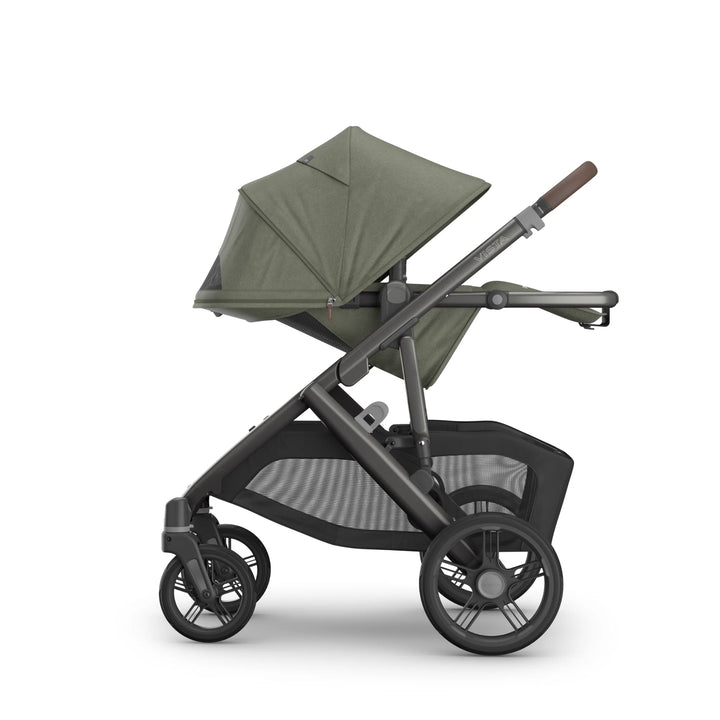 Side view of the UPPAbaby Vista V3 stroller in the Evelyn colourway, shown with the toddler seat fully reclined and UPF sun canopy extended. Features include a premium leather handlebar, large all-terrain wheels, breathable seat fabrics and an oversized under-seat storage basket, displayed on a clean white background.
