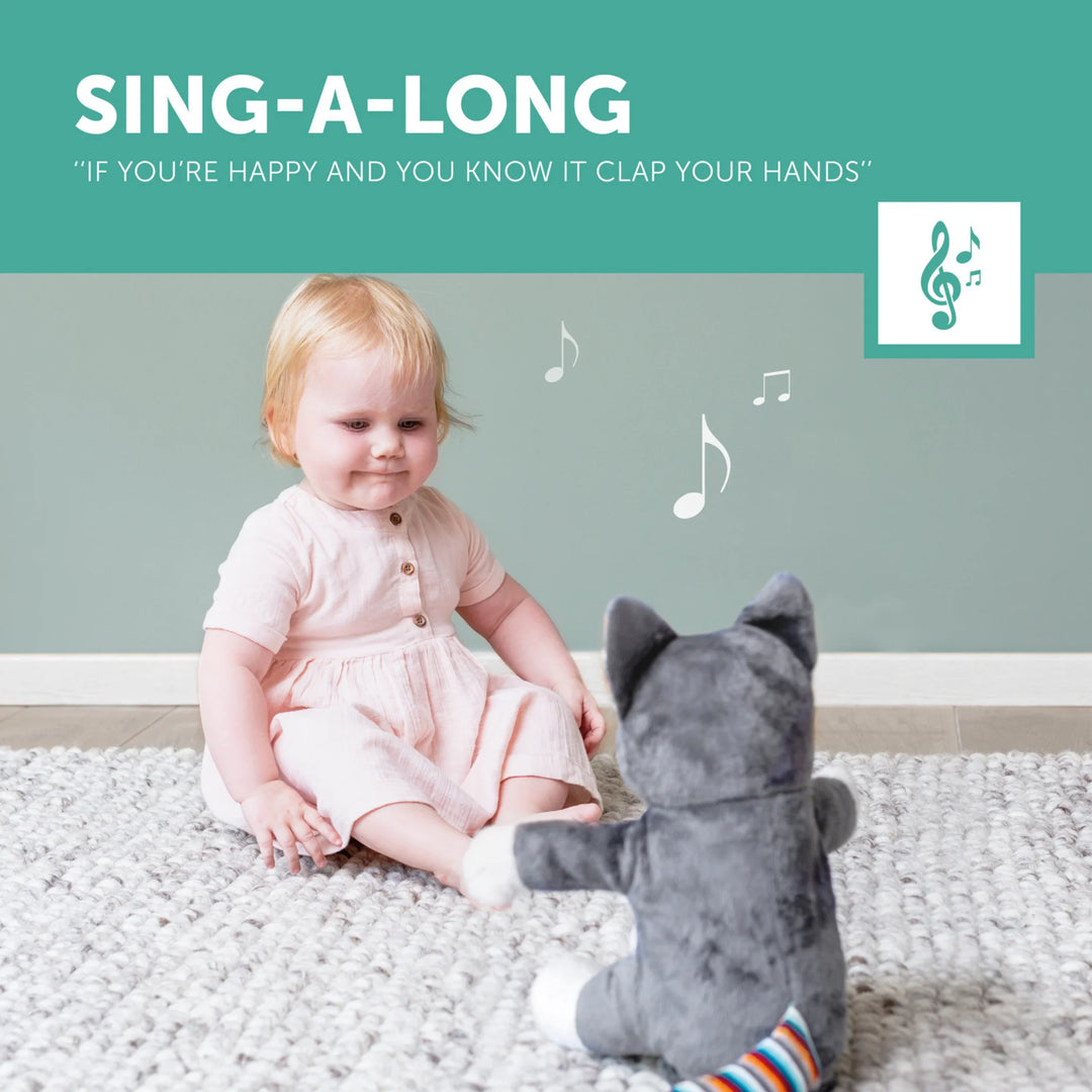 Child sitting on a rug with a plush toy, with text about singing along.