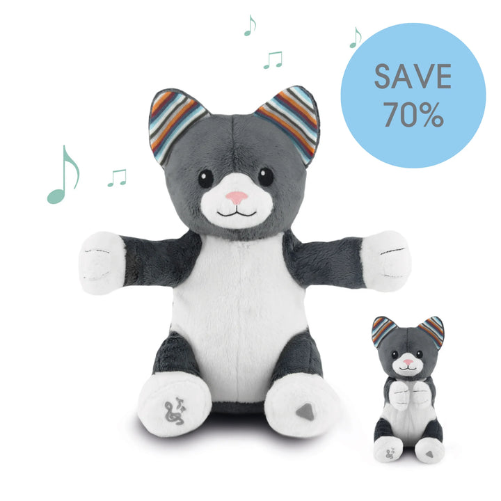 Gray and white plush cat music toy with striped ears on a white background, featuring a discount label.