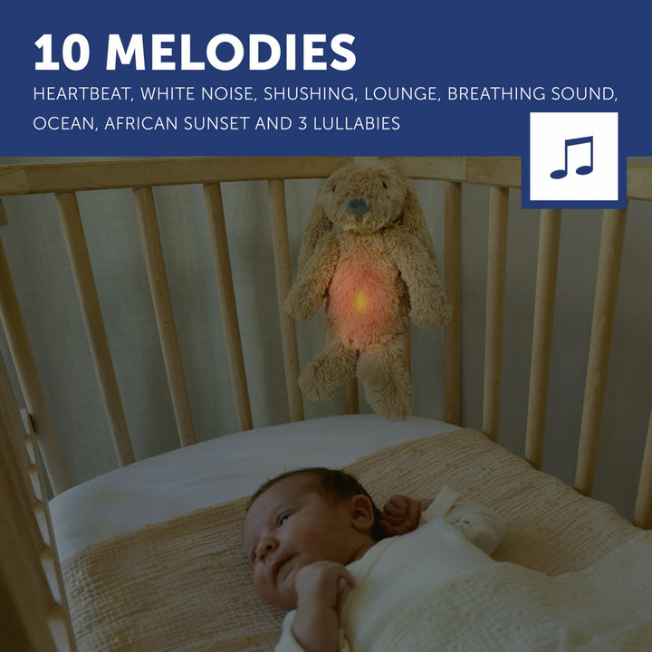 ZAZU Ro the Rabbit Sleep Soother with 10 melodies, glowing nightlight hanging above a baby’s crib to help soothe and settle to sleep.