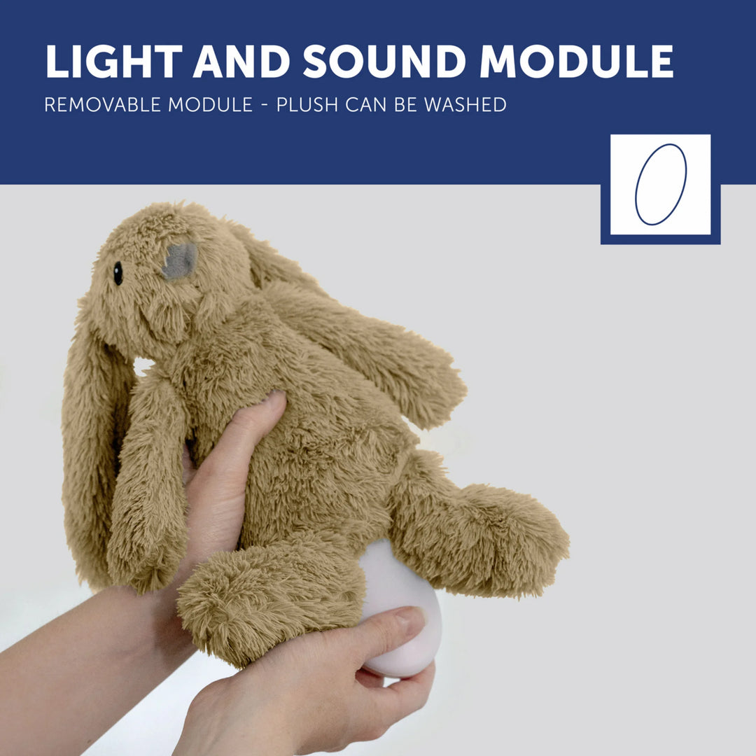 ZAZU Ro the Rabbit Sleep Soother – removable light and sound module being inserted into the plush bunny (washable soft toy with nightlight and music).