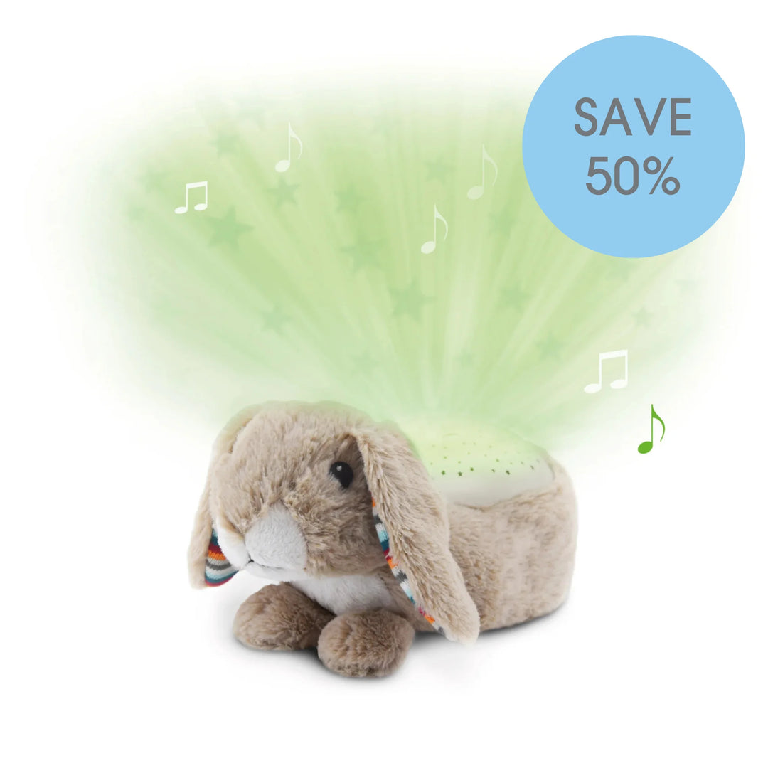 “ZAZU Ruby star projector plush bunny projecting green stars with music notes.”