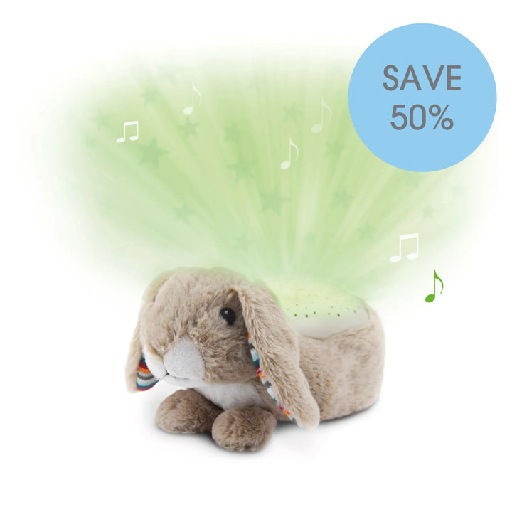 “ZAZU Ruby star projector plush bunny projecting green stars with music notes.”