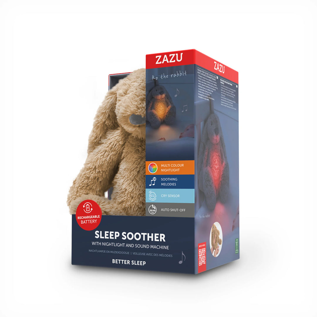 ZAZU Ro the Rabbit Sleep Soother plush night light and sound machine in retail packaging, featuring multicolour nightlight, soothing melodies, cry sensor and rechargeable battery.