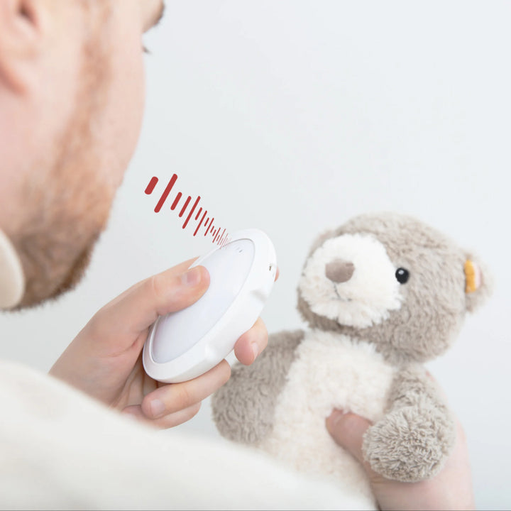 “Parent recording their voice into the ZAZU Bruno baby sleep soother sound module.”