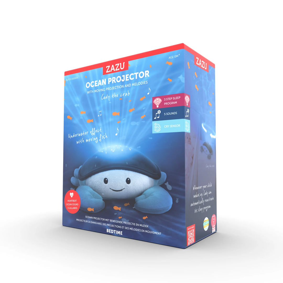Zazu Cody Ocean Projector retail packaging – plush crab-shaped baby nightlight with moving ocean wave projection, soothing melodies, 3-step sleep program, and cry sensor for baby bedtime comfort.”