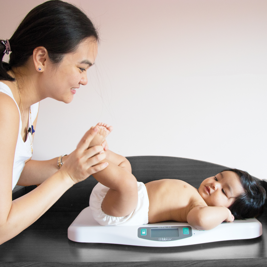 BBLuv scales with a mother being playful with her baby on the scale.