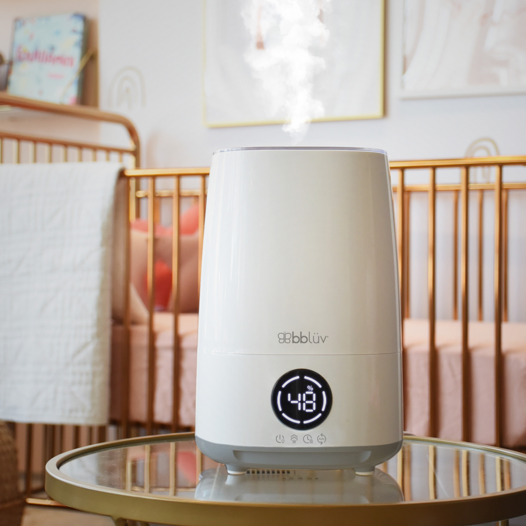 BBLuv Umido air humidifier with remote and child lock displayed on a side table in a nursery