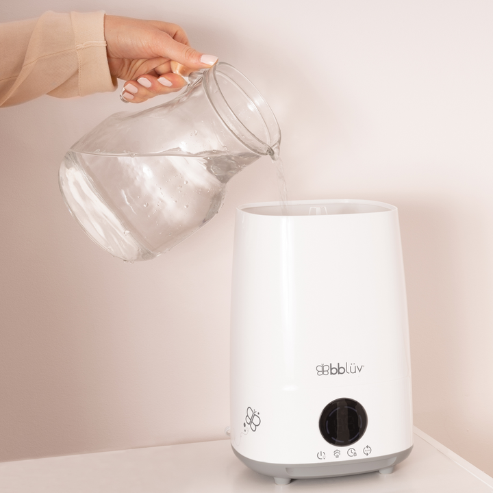 BBLuv Umido air humidifier with remote and child lock being refilled with water