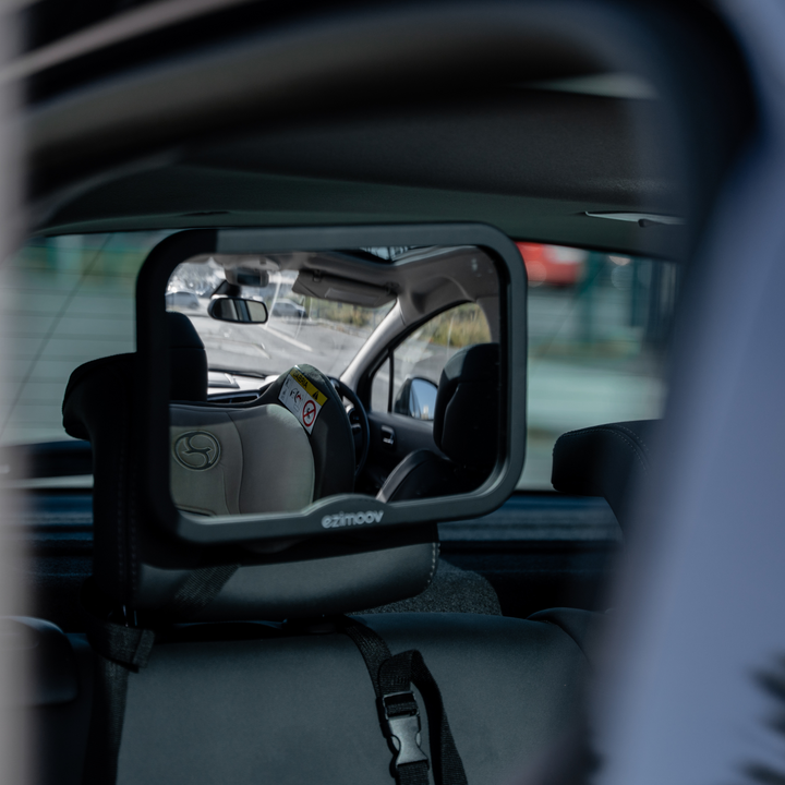 This image shows the square rear car seat mirror adjusted for the perfect view from the front seat.