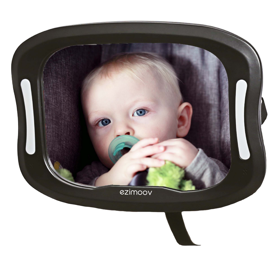 This image shows the Ezimoov LED newborn car mirror with a cute baby in the reflection.