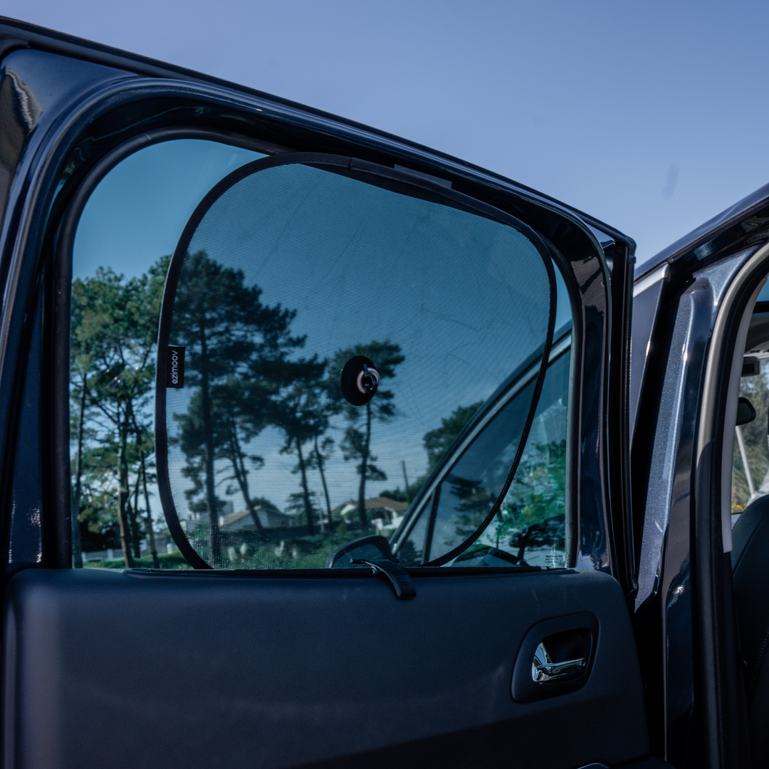 This image shows the sun shade installed on the window in the back seat of the car.